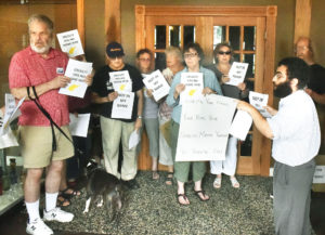 Protests staged at Rep. McKinley’s Morgantown office target Trump policies, recent comments